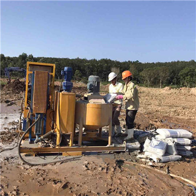 grout mixing tank and pump 