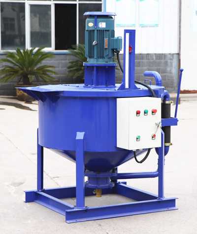 Compact grout mixing machine with storage container